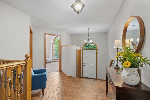 This welcoming foyer is a quiet invitation to come in, unwind, and experience the warmth that makes this house a home.