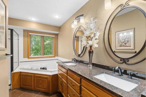The dual bowl vanity is designed with both style and functionality in mind. Its elegant granite countertops provide ample space for your daily routines.