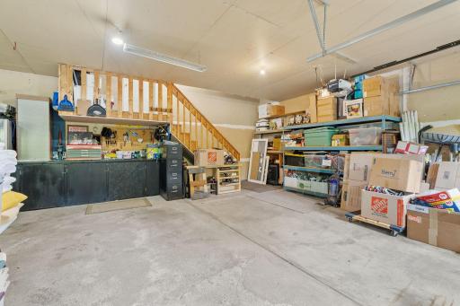 Oversize 3 car garage with access to mudroon & kitchen at the top of the stairs.
