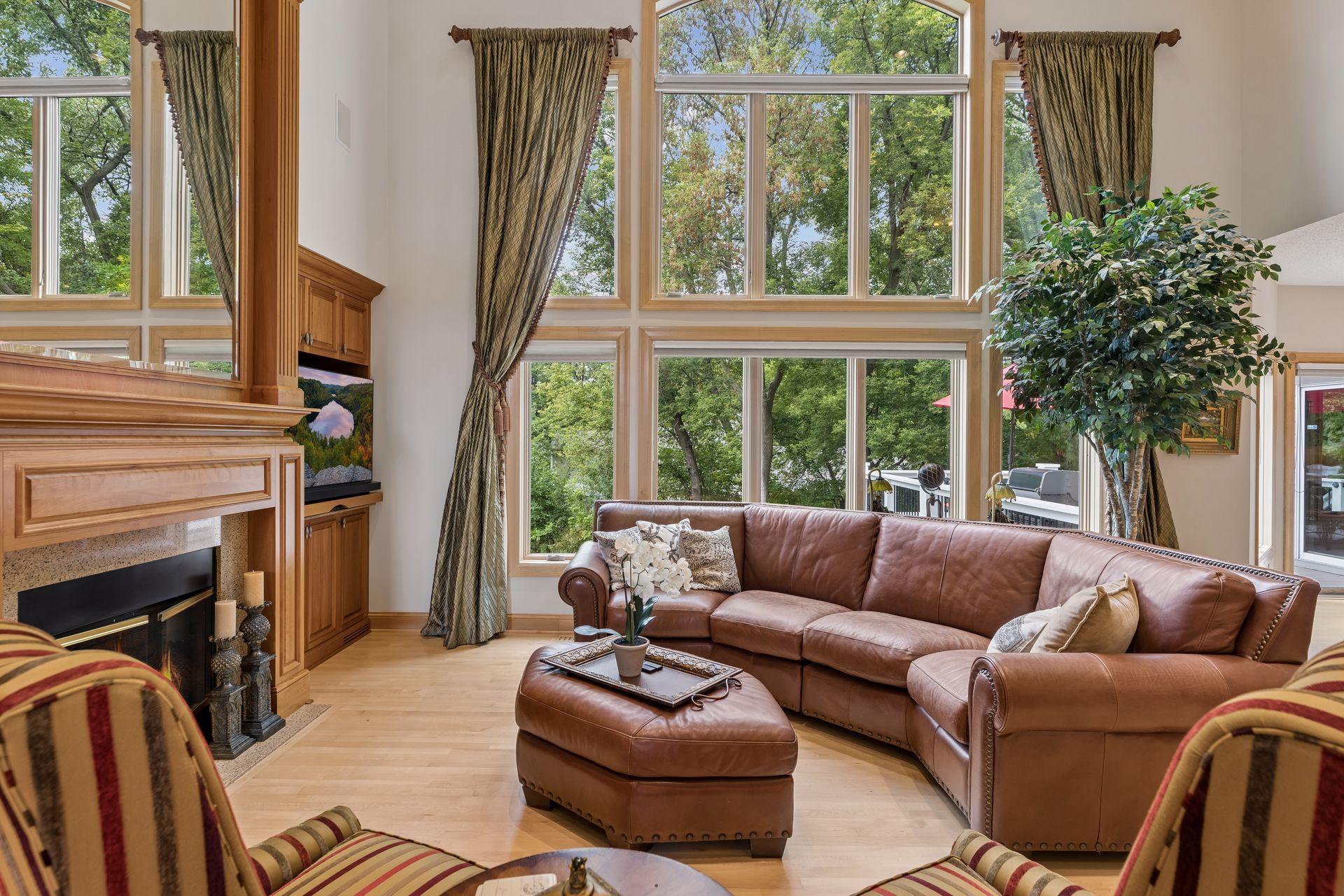 Wall of windows with 2 story Living room