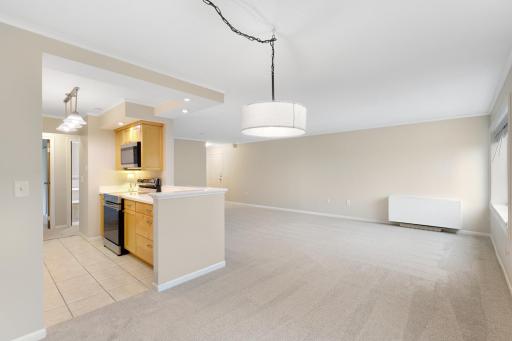 Spacious open-concept living and dining area offers plenty of flexibility for entertaining and everyday living, with neutral finishes, abundant natural light, and an easy flow into the kitchen.