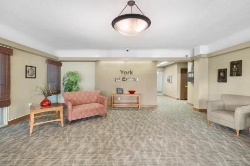 Bright, well-kept lobby at York of Edina with comfortable seating areas.