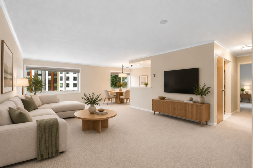 Virtually staged open living space highlighting the spacious layout, large windows, and seamless connection to the adjoining dining area. The generous floor plan offers plenty of room for comfortable everyday living and entertaining.