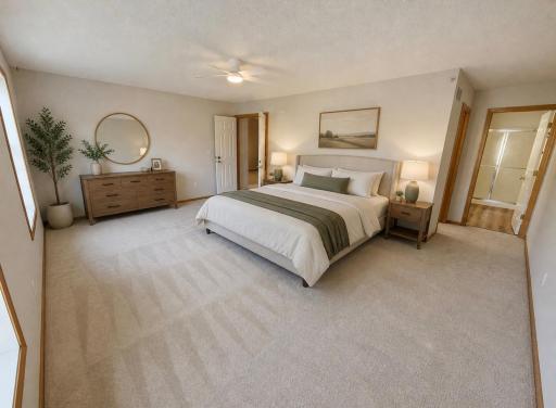 Primary Bedroom with an en-suite bathroom and walk-in cloet