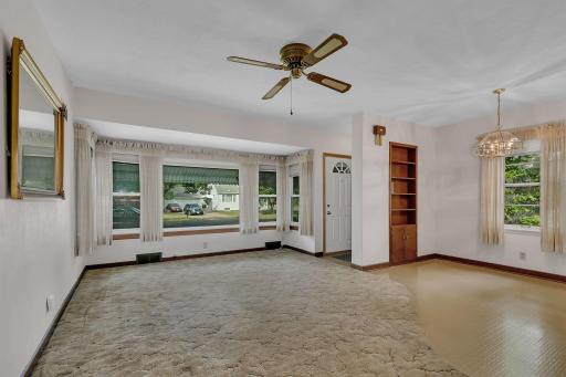 Large front windows capture the natural light