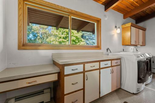 Built-in cabinetry and counter space provide a handy spot for storage, projects, and more