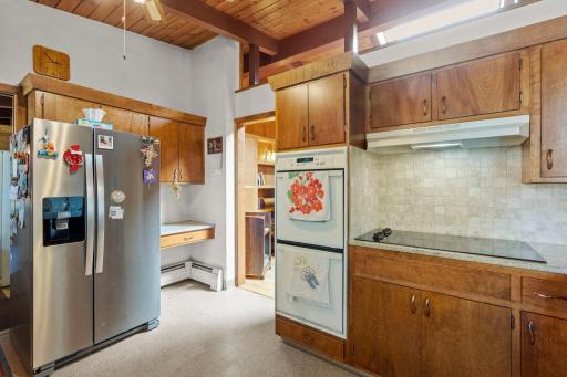 Granite countertops add a durable, updated touch alongside the kitchen’s warm wood cabinetry