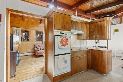 Another look at the kitchen’s generous storage and distinctive design, with an easy connection to the adjoining living room