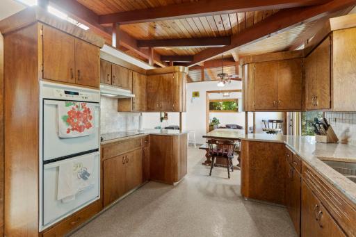 Unique cabinetry and thoughtful built-ins give the kitchen plenty of storage and a style all its own