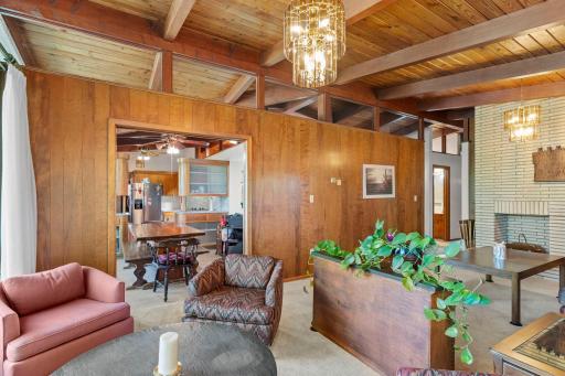 The open layout allows the living and dining spaces to connect easily while still giving each area its own character