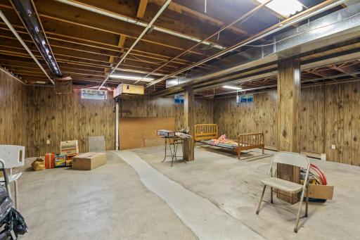 The unfinished lower level offers an incredible amount of additional space ready to be transformed to fit your needs