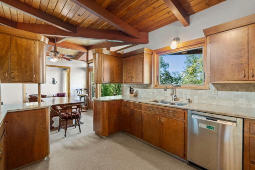 A large window over the sink brings in natural light and offers a pleasant view while working in the kitchen