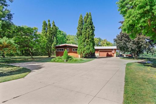 Mature landscaping and established trees add character to the home’s welcoming exterior