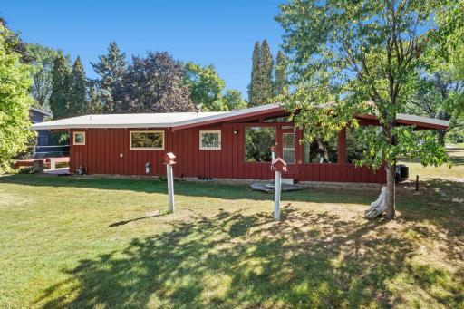 A look back at the home from the yard highlights its unique rambler design and sprawling one-level layout
