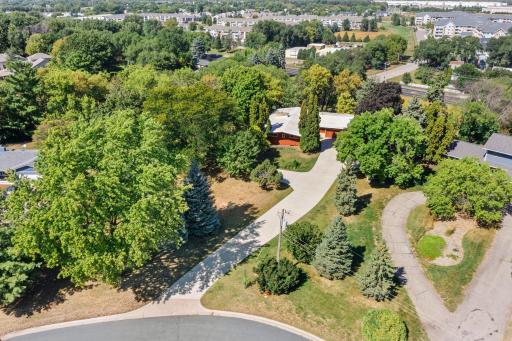 Surrounded by mature trees and greenery, the property offers a wonderful sense of space and privacy in a convenient location