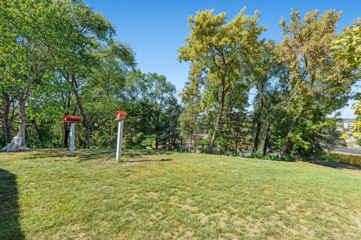 Mature trees line portions of the property, creating a beautiful natural backdrop and added privacy