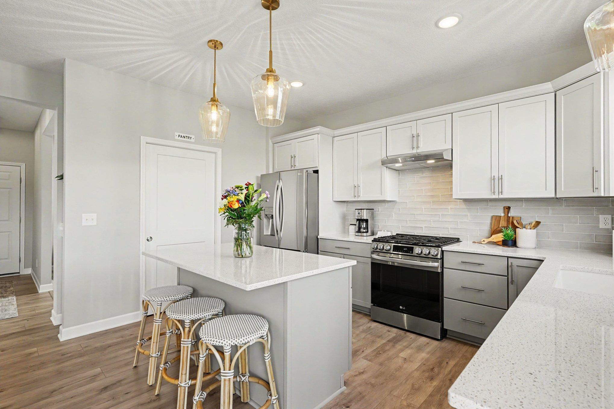 A clean bright kitchen with upgrades stainless appliances