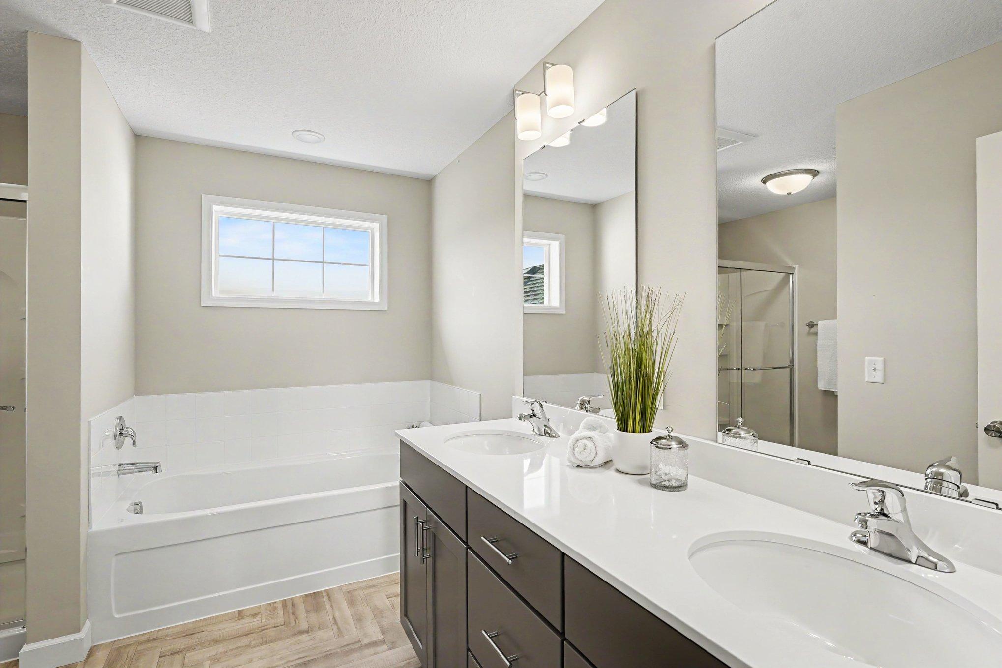 Owner's private bathroom oasis flooded with natural light