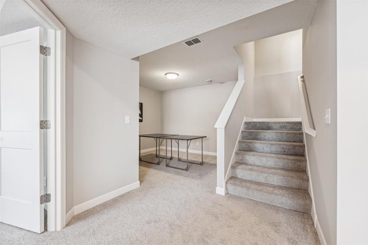 Lower level game room from previous listing