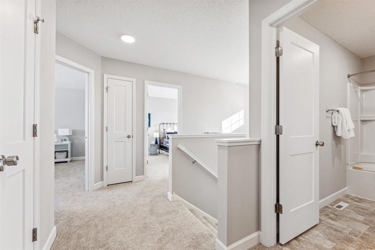 Upper level hallway is easy access to 3 bedrooms