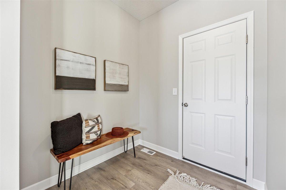 Mudroom off garage with room for a bench or built in lockers