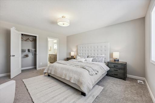 Staged photo showing the spacious Owner's suite