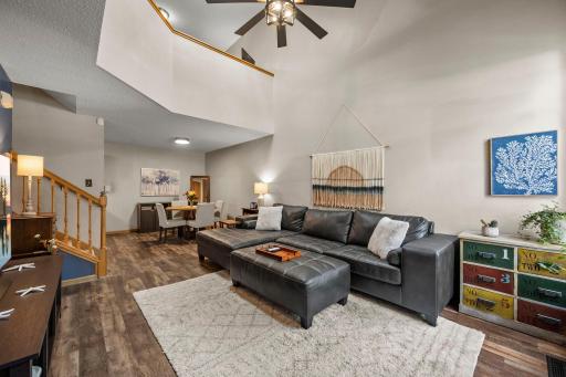 Greeted by soaring vault bright skylight and updated lighting/ceiling fan