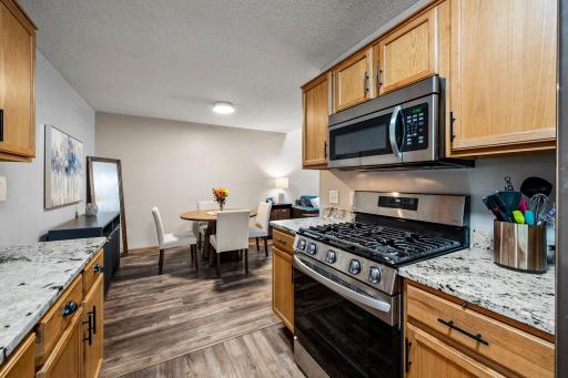 LVP flooring, Stainless Steel appliances (GAS RANGE!( and granite countertops