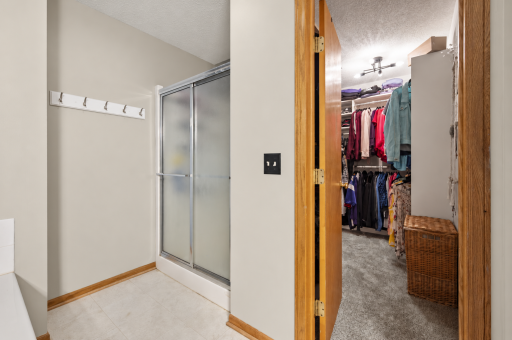 Primary walk in shower and huge walk in closet