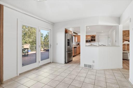 Seamless indoor-outdoor living awaits with the dining space opening directly to a spacious deck, perfect for effortless entertaining!