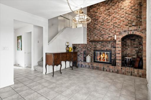 Enjoy cozy dinners by the beautiful brick fireplace!