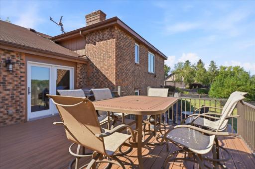 Step outside to the expansive deck, perfect for outdoor dining, entertaining, or simply enjoying the peaceful surroundings!