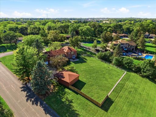 A fully fenced 1-acre property offers exceptional versatility with ample space for vehicles, recreational toys, hobbies, storage, and a workshop!