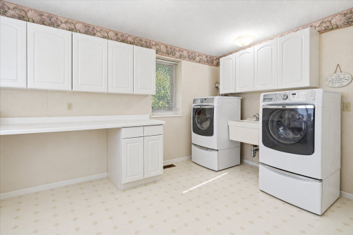 A spacious laundry room offers plenty of room for organization, storage, and everyday convenience!