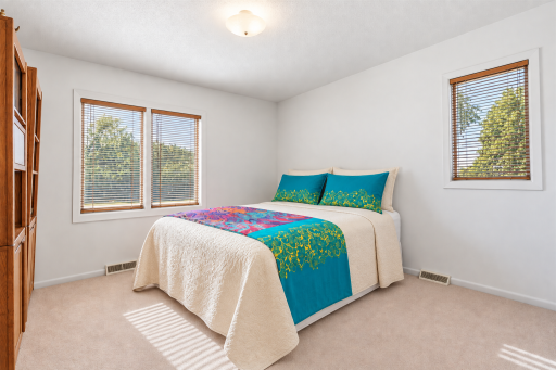 The third upper-level bedroom is filled with beautiful natural light!