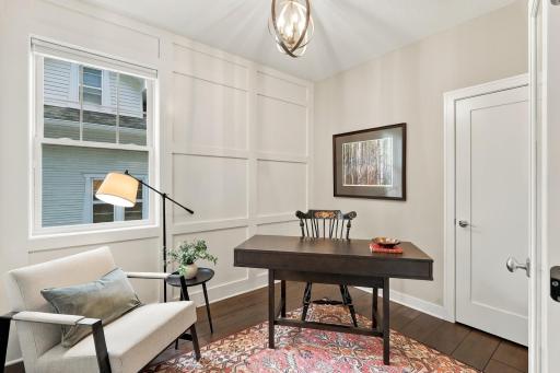 Main floor office with enameled wood paneling