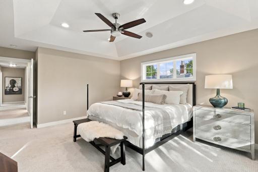 Primary bedroom captures the morning light