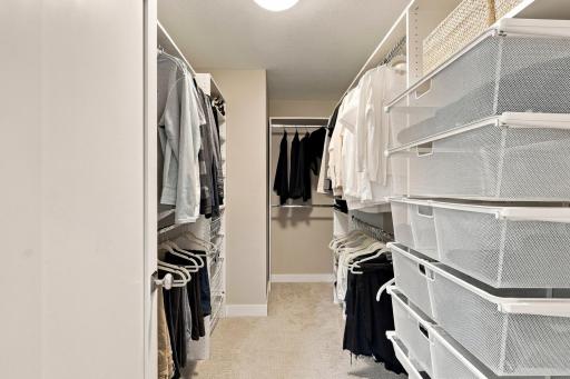 Primary bedroom walk-in closet