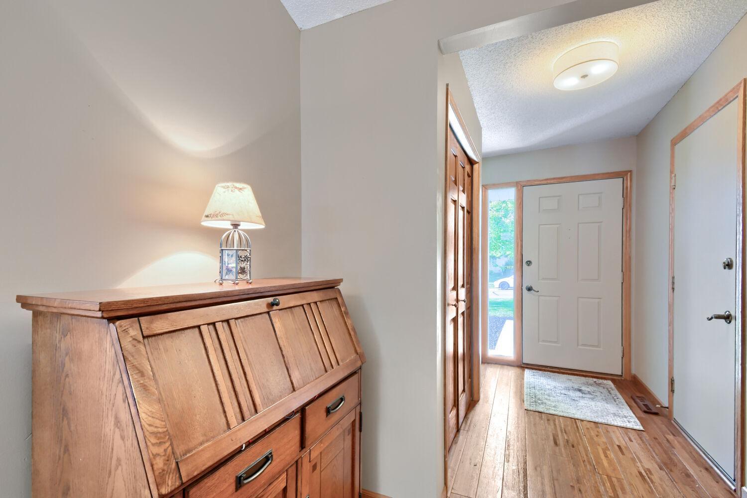 Large foyer with closet and extra nook at front door.
