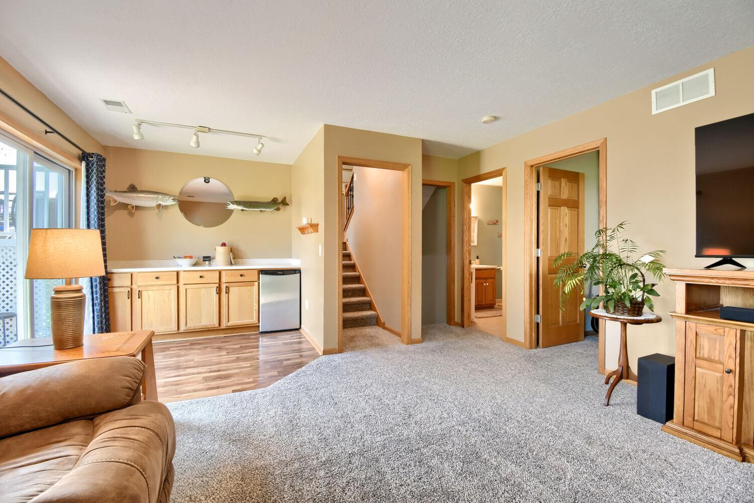 Dry bar with fridge in family room
