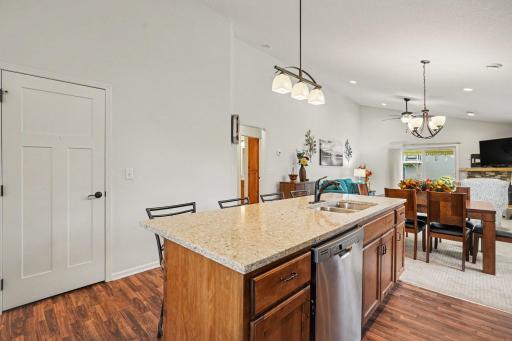 The kitchen includes a large pantry closet for all your kitchen needs. The floors are a beautiful luxury vinyl tile and the countertops are granite. The kitchen is open to the informal dining and livin room.
