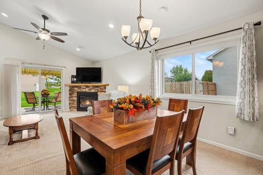 The informal dining room is open to the kitchen and living room. It features a large window (Andersen windows & patio door new 2024) that fills the room with natural light.