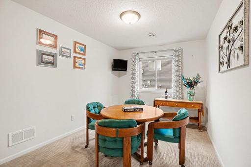 The 2nd front bedroom includes a newer window and a large closet with 3-panel French doors. It's currently being used as a game room.