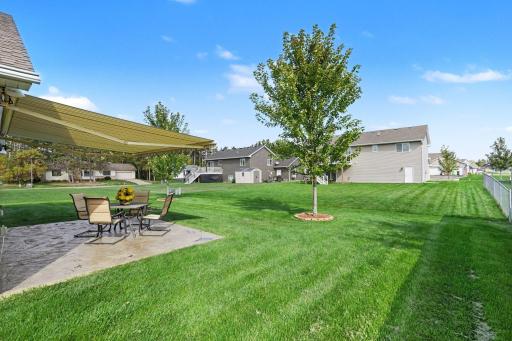 This view of the backyard shows the SunSetter awning open. It's controlled with a remote and has a sensor that automatically closes when the window is too high.