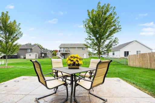 The large backyard stamped and colored concrete patio (17'x12') is the perfect place to relax in the sun or shade. A SunSetter awning was added in 2022.