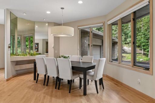 Bright dining area with oversized windows.