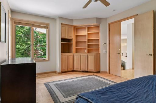 Main-level bedroom with custom built-ins.