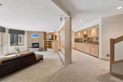 Lower-level entertaining space with wet bar.