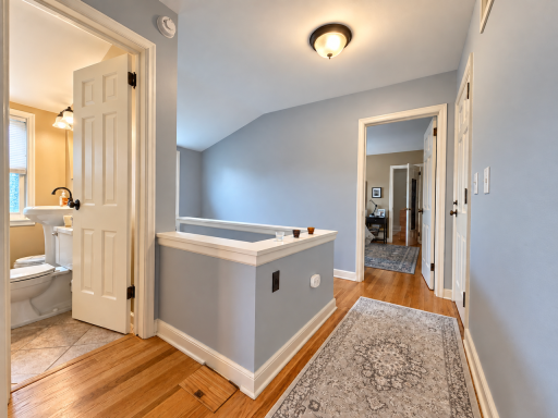 Gather downstairs, retreat upstairs. The landing connects the bedrooms and bath on a separate level, giving the home a natural division between shared living space and personal space.