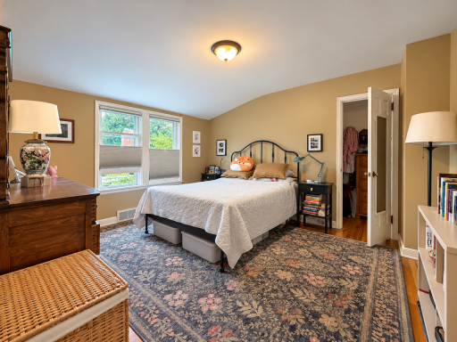 Head upstairs at the end of the day to a bedroom set apart from the main living spaces. Features updated double windows, hardwood floors, closet storage and room for the furniture you use every day.